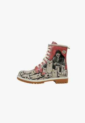 Boots with a beige and pink design, featuring cat illustrations and a figure. White laces, rubber sole, and textured finish.