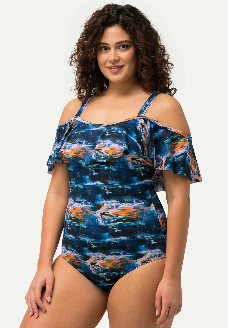 Maillot de bain une pièce multicolore avec des manches à volants dénudées, présentant une base bleue ornée de motifs abstraits orange et rose.