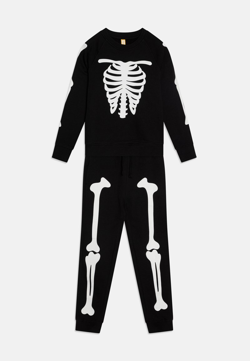 Black sweatshirt and pants set featuring white skeleton print. Sweatshirt displays ribcage and bones; elastic waistband on pants. Soft fabric.