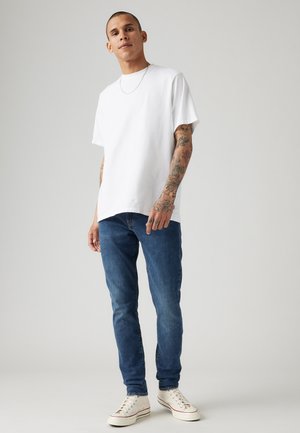 512™ SLIM TAPER JEANS - Džíny Slim Fit - medium indigo worn in