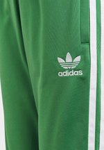 adidas sst green track pants