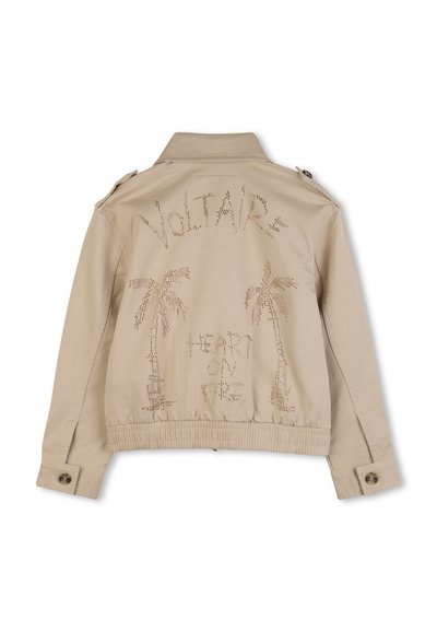 Veste bomber beige avec col, ornée d'embellissements métalliques en forme de palmiers et texte au dos, avec ourlet élastiqué.