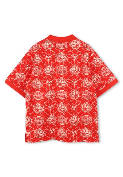 T-shirt rouge à manches courtes avec un motif graphique floral et de tigre blanc, comportant le texte "KENZO PARIS" et un col côtelé contrasté.