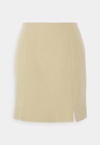 Mini-jupe beige avec une texture lisse, un design droit et des fentes latérales pour plus de mobilité. Fabriquée en tissu doux et léger.
