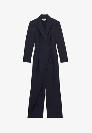 Tamsiai mėlynos juostelės kombinezonas su ilgomis rankovėmis, šalikiniu apykakle ir aptemta liemeniu. Klostuotas dizainas su plačiomis kelnėmis, pagamintas iš lygaus audinio.