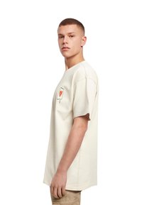 Merchcode HEARTBREAK HEAVY  - T-shirts print - sand