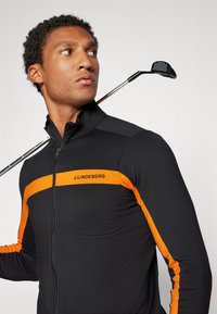 J.LINDEBERG Sports JARVIS MID LAYER - Sportinė striukė - persimmon orange