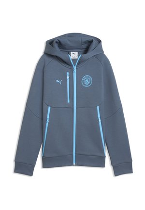 Mørkegrå hættetrøje i sportstil med lyseblå lynlåse og Manchester City- og Puma-logoer på brystet, vist fladt på hvid baggrund.