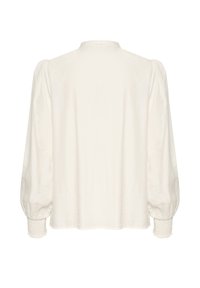 White blouse featuring long, puffed sleeves with textured, smocked cuffs. Smooth fabric and a simple, collarless neckline.