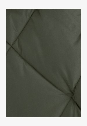 Tessuto in pile verde scuro con motivo trapuntato. Texture liscia, finitura leggermente lucida e cuciture visibili alle giunture.