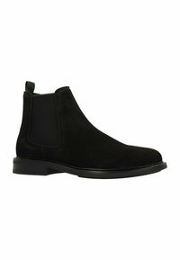 Zwarte nubucklederen Chelsea boots met elastische zijpanelen, trekhaak, ronde neus en een elegante zwarte rubberen zool. Textuur bovenkant met een gladde afwerking.