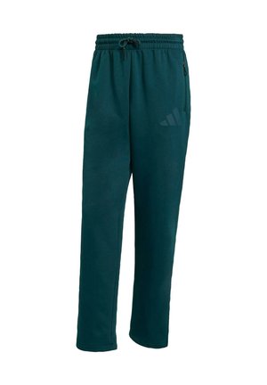 Aqua kleurige sportbroek van zacht materiaal, met een elastische tailleband, koordjes, zijzakken en een subtiel logo op het been.