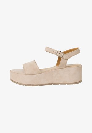Sandali con zeppa in suede beige, dotati di una ampia fascia sul davanti, cinturino alla caviglia regolabile e suola piattaformata chunky. Texture semplice e liscia.