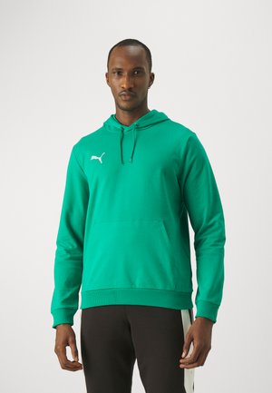 Haut à capuche vert en tissu doux, doté d'une poche kangourou, de bords côtelés aux manches et à l'ourlet, avec un logo Puma blanc sur la poitrine gauche.