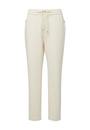 Pantalon de survêtement fuselé de couleur crème avec taille élastique, cordon de serrage ajustable et poches latérales zippées.