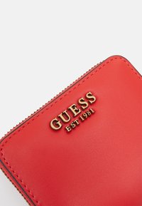 Guess LAUREL SMALL ZIP AROUND - Portefeuille - orange
