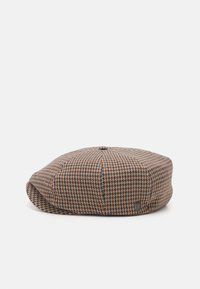 Căciulă plată în nuanțe de brun, portocalie și navy, cu un model houndstooth. Fabricată dintr-un material texturat, cu un buton de sus și o mică etichetă logo pe lateral.