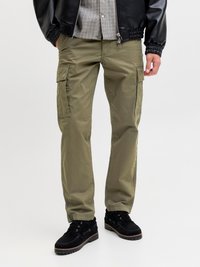 Olive green cargo pants with side pockets, a straight shape, and durable fabric. Paired with black suede shoes and a black jacket.