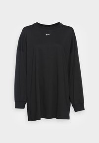 Svart långärmad t-shirt i bomull med rund halsringning, avslappnad passform och vit Nike-logotyp på bröstet.