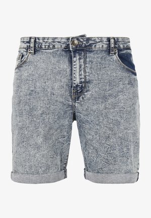 Short en jean bleu clair délavé à l'acide avec revers roulés, fermeture avant par bouton et zip, ainsi que des poches avant et arrière.
