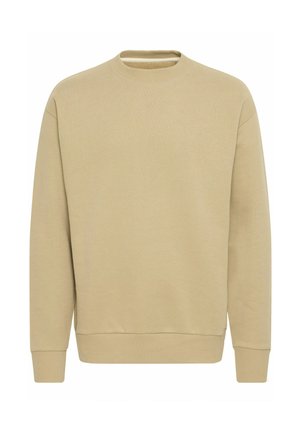Beige huppari, jossa on pitkät hihat, pyöreä kaula-aukko, ribbireunat hihansuissa ja helmassa. Tasainen pinta, ilman näkyviä kuvioita tai grafiikkaa. Yksinkertainen muotoilu.