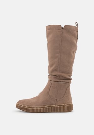 Tall light brown suede boot with ribbed sole, stitching details, and pull tab at back, shown in side profile on white background.