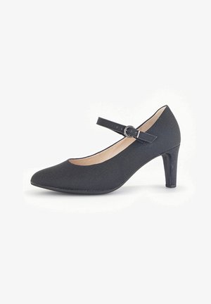 Black Mary Jane high heel shoe with pointed toe, canvas texture, adjustable strap with silver buckle, and a sleek 3-inch heel.