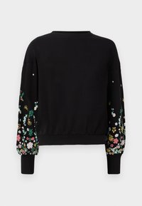 Sweat-shirt noir à manches longues avec des imprimés floraux colorés sur le bas des manches, des poignets et une ceinture côtelés, avec un col rond.
