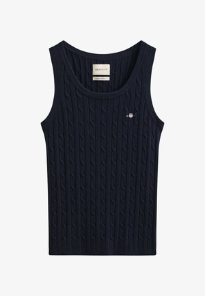 Mørkeblå kabelstrikket ærmeløs tanktop med rund halsudskæring og lille broderet logo på venstre bryst.