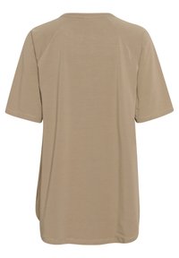 Beige kortärmad t-shirt med rund hals. Slät textur och avslappnad passform. Rak fåll utan synliga knappar eller utsmyckningar.