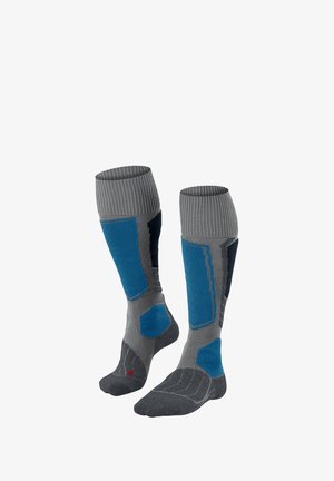Chaussettes hautes grises et bleues avec des poignets côtes, des sections rembourrées et des talons renforcés. Fabriquées à partir d'un matériau texturé avec des motifs contrastés.