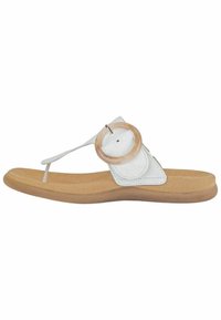 Sandale en cuir blanc avec un accent en bois rond, semelle plate beige et design à fines lanières. Comprend un entre-doigt pour un maintien sécurisé et un confort optimal.