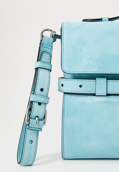 Textured light blue suede handbag with a flap closure, adjustable strap, and contrast stitching details. Features a minimalist design.
