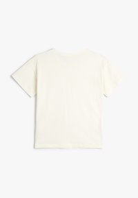 Korte mouwen, crème kleurig t-shirt gemaakt van zachte katoen, met een eenvoudig, glad ontwerp, een ronde halslijn en zonder zichtbare patronen.