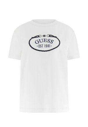 White cotton t-shirt with short sleeves and a round neckline. Features "GUESS EST 1981" embroidered in navy within an oval rope design.