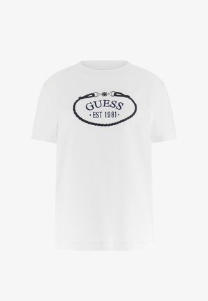 Hvid bomuld T-shirt med korte ærmer og rund hals. Har "GUESS EST 1981" broderet i marineblåt inden for et ovalt rebsdesign.