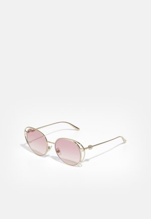 Lunettes de soleil - pale gold-coloured