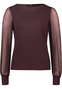 Bordeaux top med ensfarvet bodice og gennemsigtige plisserede, lange ærmer. Har en rund halsudskæring og tætsiddende manchetter ved ærmeslutterne.