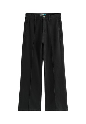 Schwarze weite Baumwollhosen mit Knopfverschluss, seitlichen Taschen und gestickten Details entlang der Falten.
