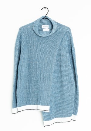 Blue knit sweater with high folded collar, ribbed texture, and white cuffs with black stitching, hanging on black hanger against white background.