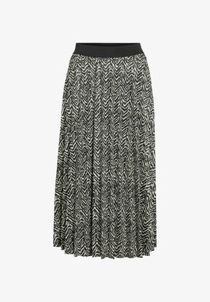 Maxikjol med svartvitt chevronmönster, bred elastisk midjeresår och plisserad design, tillverkad av lättviktigt tyg.