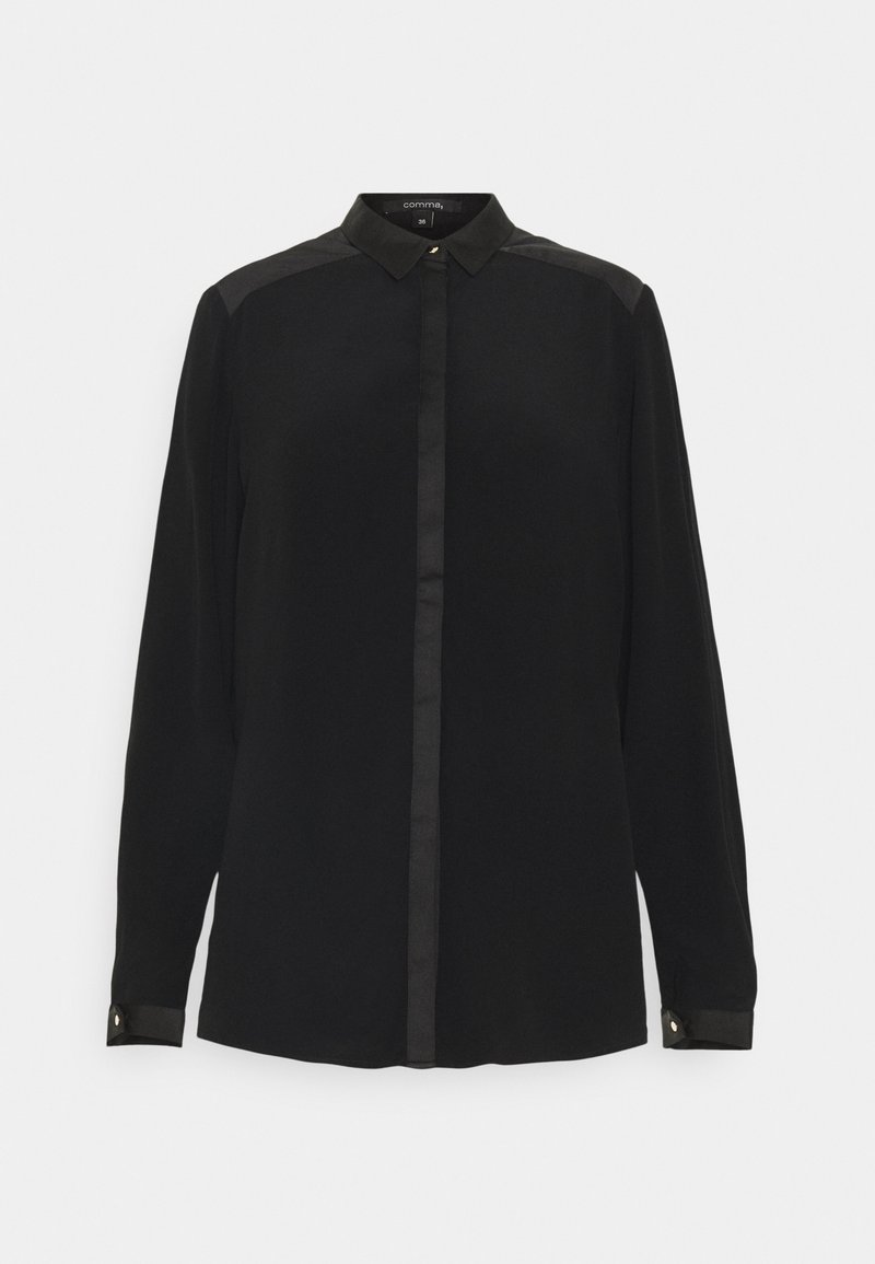 Blouse noire à manches longues avec col pointu, boutons dissimulés sur le devant et poignets boutonnés, taille 38 de la marque "comma", sur fond blanc.