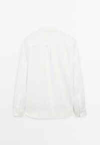 White long-sleeve shirt made from lightweight fabric, featuring a buttoned cuff and a simple back design with a center pleat.