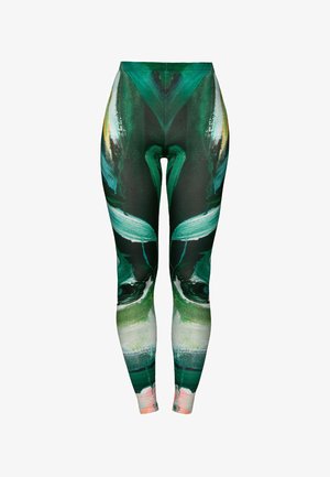 Kõrge talje pikkade retuuside rohelise abstraktse disainiga, sile kangas ja elav muster, mis ühendab roheline ja roosa toone.