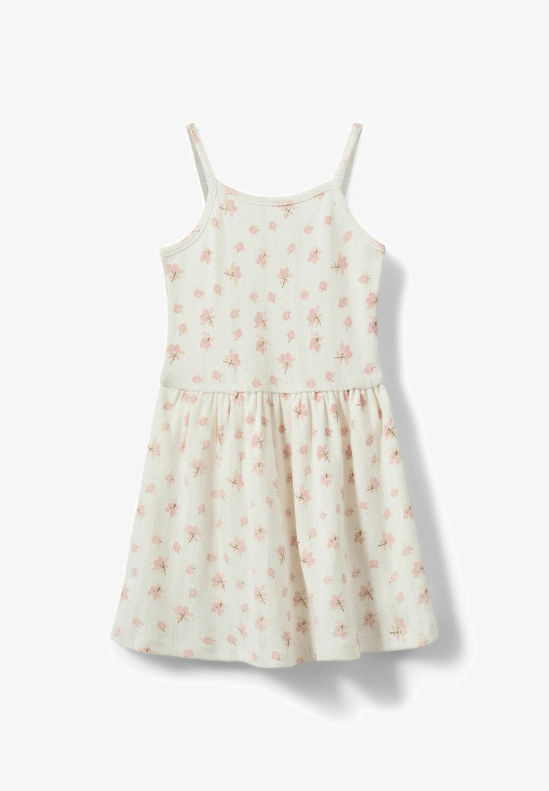 Robe blanche sans manches avec fines bretelles et imprimé floral rose, présentant un corsage ajusté et une jupe froncée.