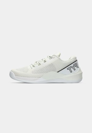 White athletic shoe with a mesh upper, lace fastening, and textured accents. Features a sturdy white sole and a black logo on the heel.