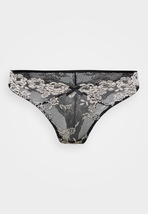 Svart blonde stringtruse med blomsterdesign, med rutete tekstur. Dekorativ sløyfe foran. Mykt og lett materiale.