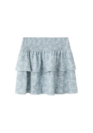 Jupe à volants bleu clair avec une taille smockée, présentant un motif cachemire dans une teinte plus claire. Fabriquée dans un tissu doux et texturé.