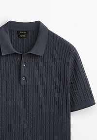 Dark blue short-sleeve polo shirt featuring a textured cable knit pattern, two-button placket, and ribbed collar and sleeves.