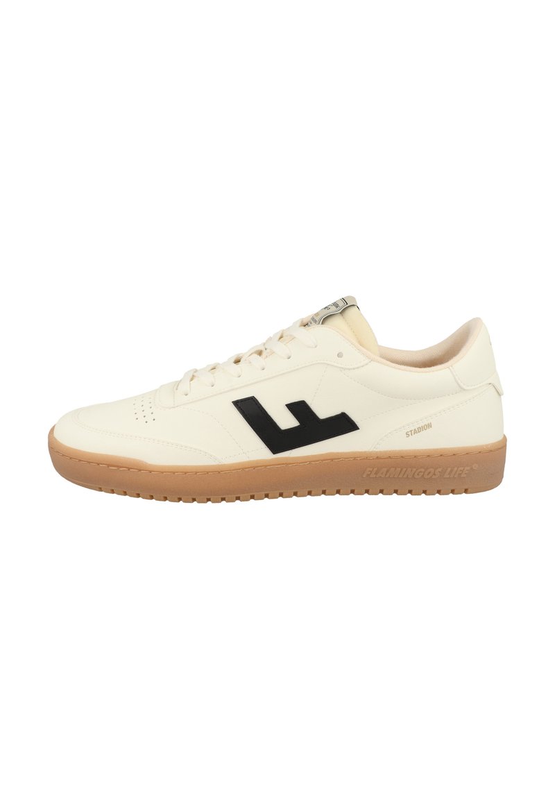 White sneaker with black logo, featuring a smooth leather upper, lace-up design, and a tan rubber outsole with textured pattern.